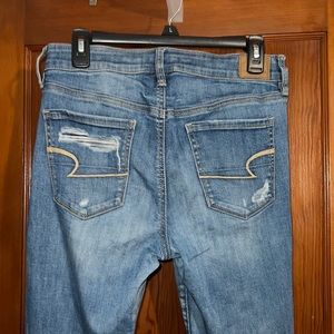 American Eagle Super Stretch X medium wash Hi-Rise Jegging Ripped size 10